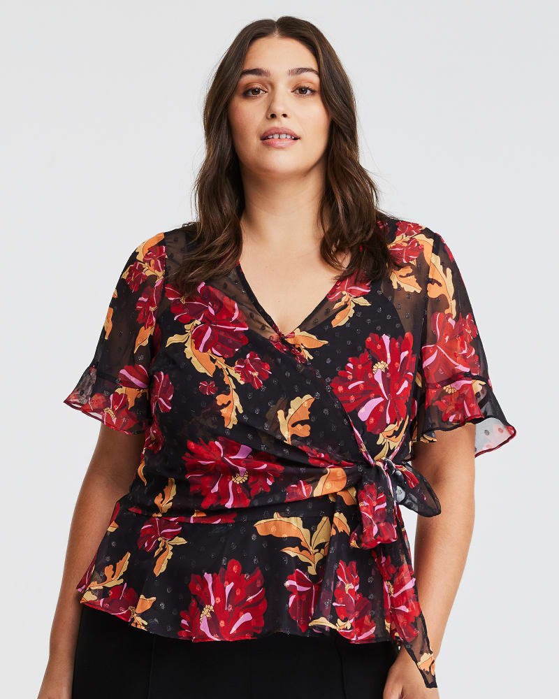 Front of a model wearing a size 18W Midnight Petal Top in Print by Estelle. | dia_product_style_image_id:323858